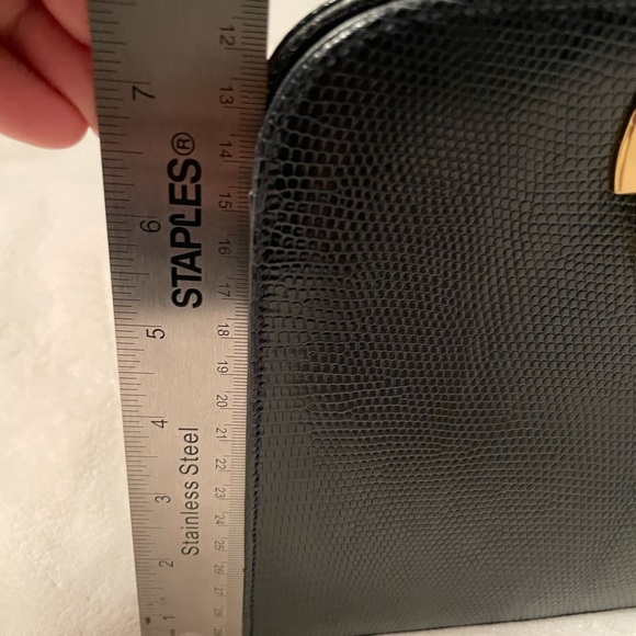 Authentic Salvatore Ferragamo black leather bag with shiny gold metal handle. - Picture 6 of 11